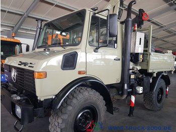 Dropside/ Flatbed truck, Municipal/ Special vehicle Unimog U1450 4x4 Fassi Kran mit FB + Winde Bergstütze: picture 1