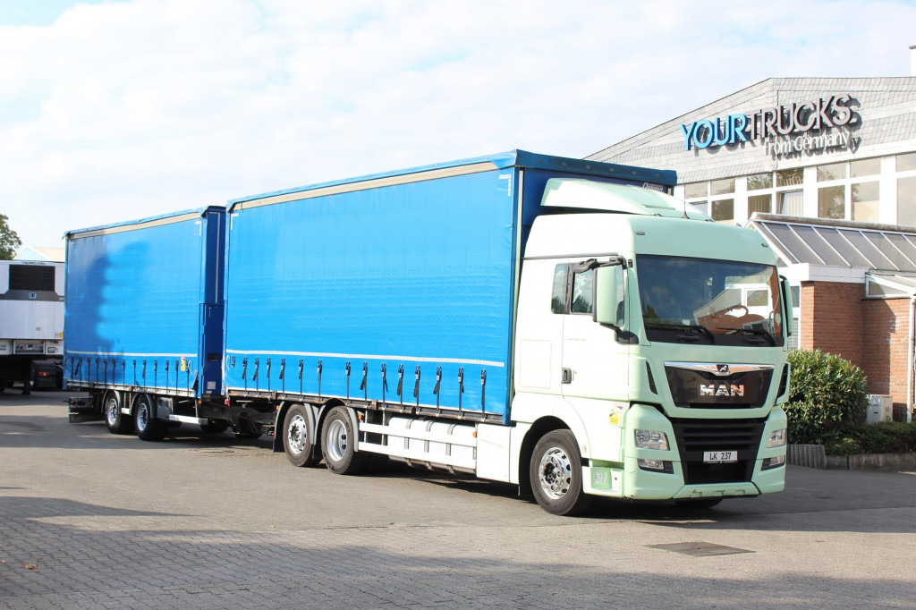 MAN TGX 26.460 Retarder Jumbo-Zug 120M3 Durchlade - Curtain side truck: picture 1 MAN TGX 26.460 Retarder Jumbo-Zug 120M3 Durchlade - Curtain side truck: picture 1