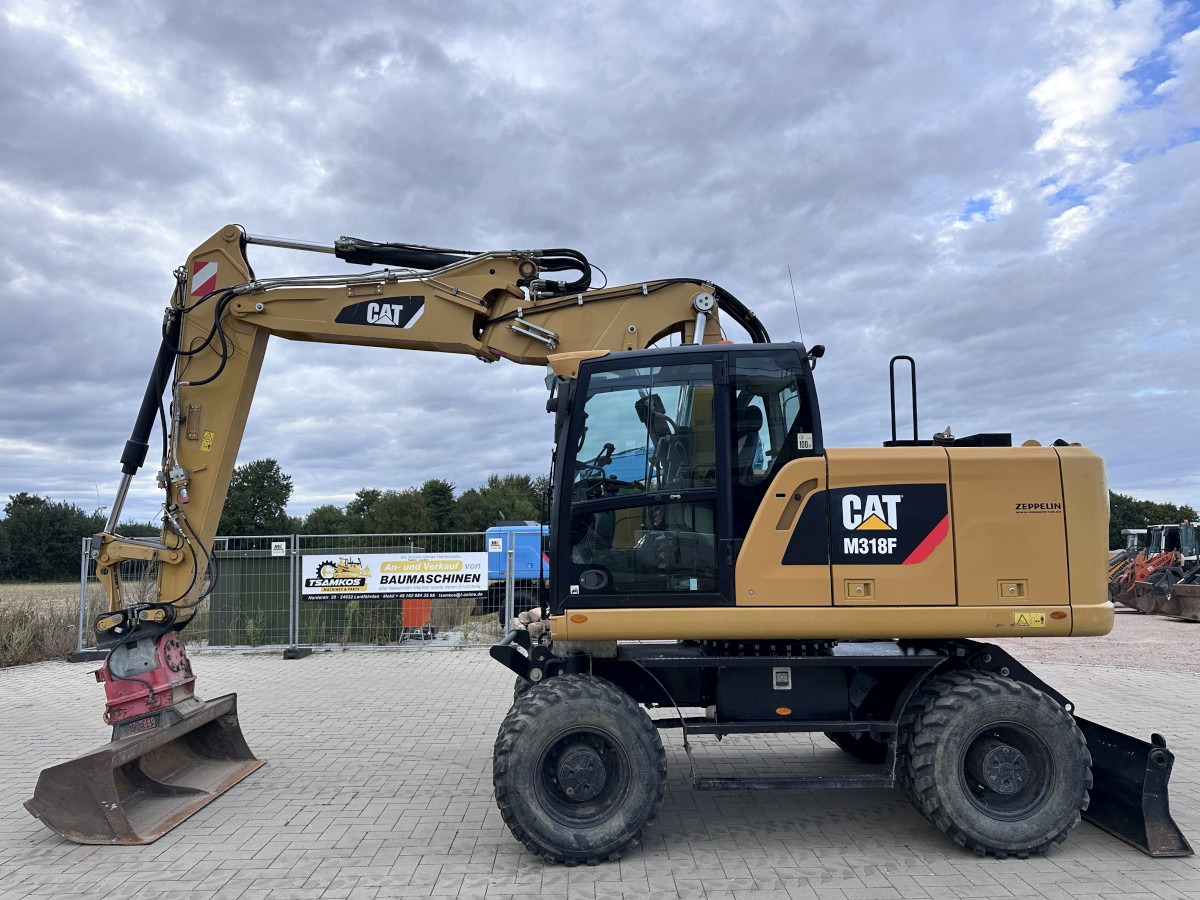 CATERPILLAR M 318 F Offset boom Deutsche Maschine Top ! - Wheel excavator: picture 1 CATERPILLAR M 318 F Offset boom Deutsche Maschine Top ! - Wheel excavator: picture 1