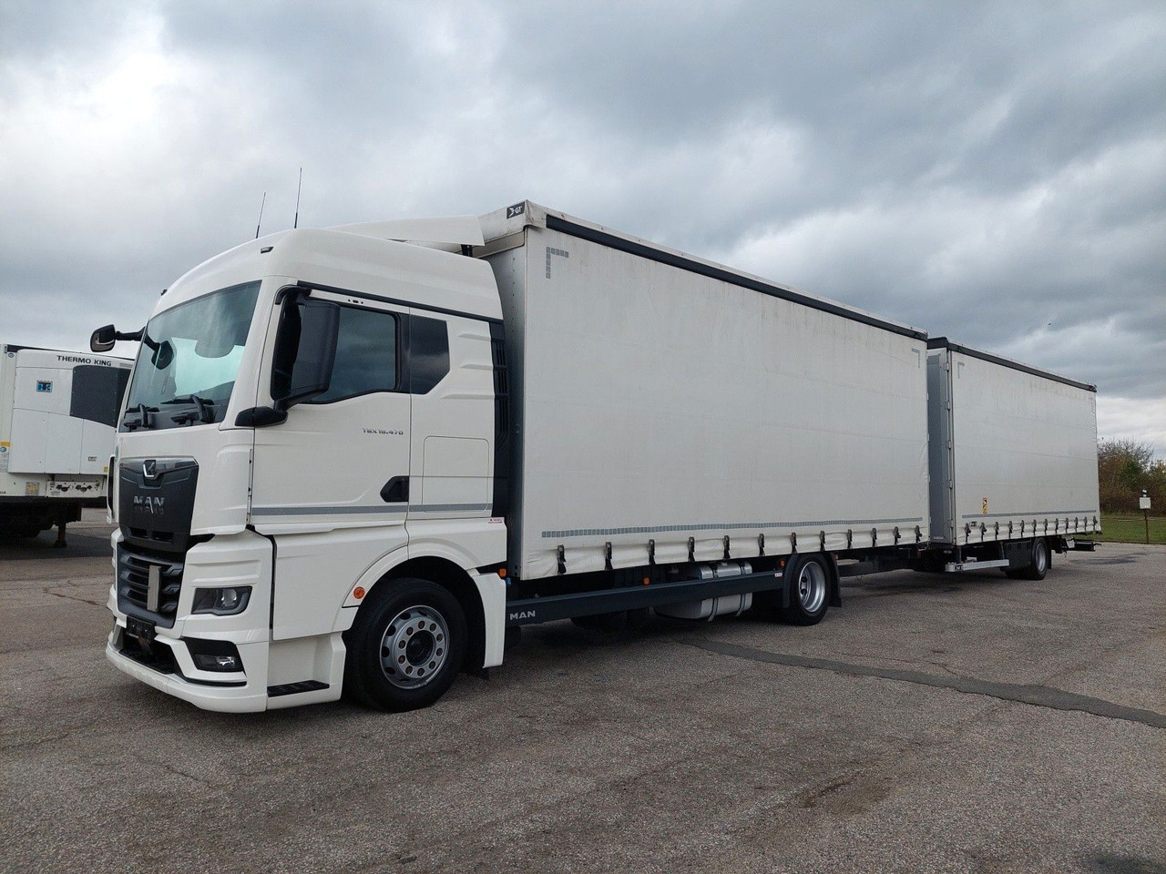 MAN TGX 18.470 LL + Gniotpol G-4080 120 m3 Durchbar - Curtain side truck: picture 1 MAN TGX 18.470 LL + Gniotpol G-4080 120 m3 Durchbar - Curtain side truck: picture 1
