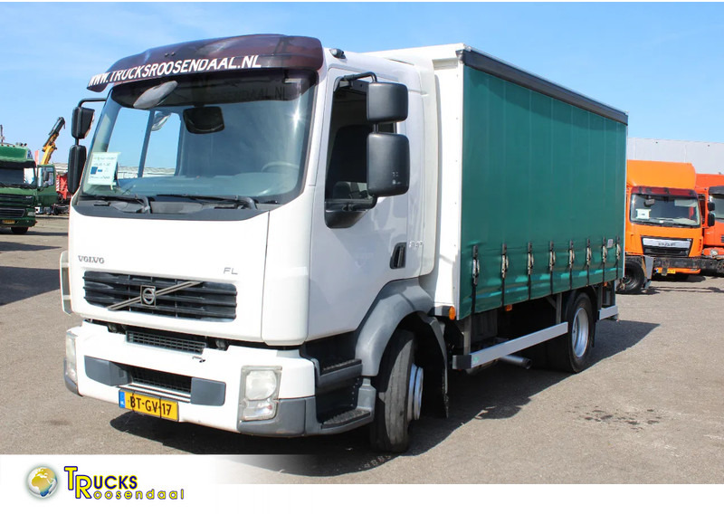 Volvo FL 12 .240 + LIFT + MANUAL - Curtain side truck: picture 1 Volvo FL 12 .240 + LIFT + MANUAL - Curtain side truck: picture 1