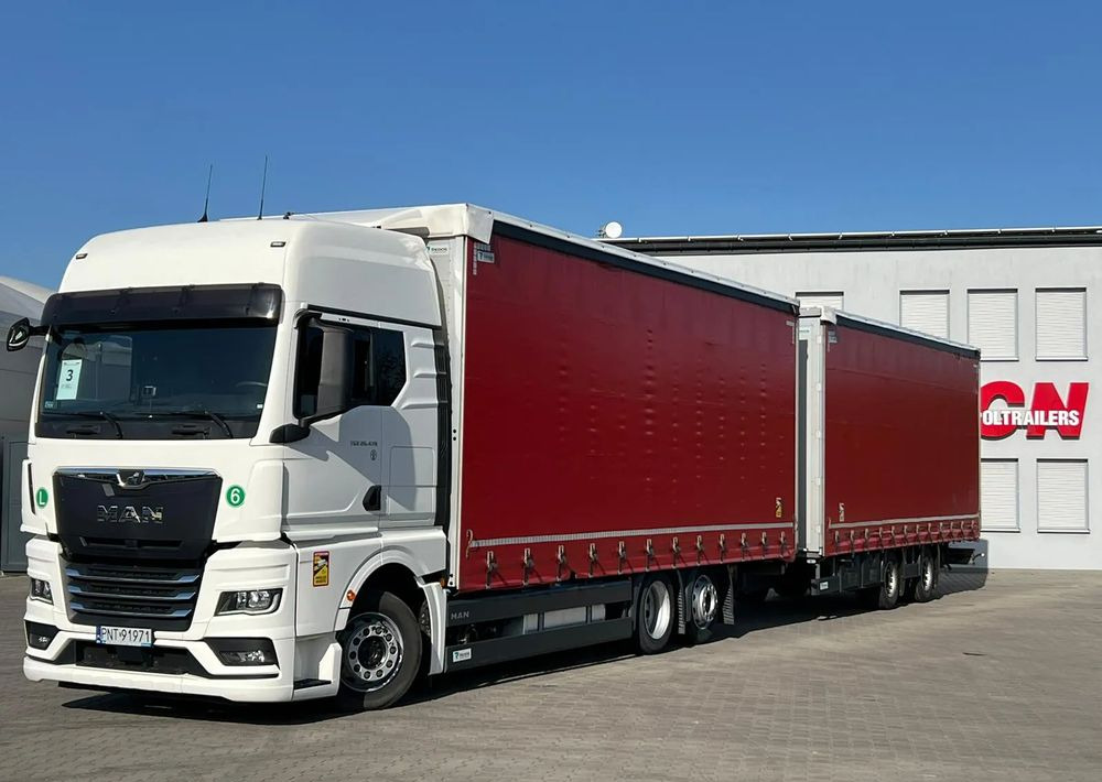 MAN TGX 26.470 z przyczepą Redos - Curtain side truck: picture 1 MAN TGX 26.470 z przyczepą Redos - Curtain side truck: picture 1