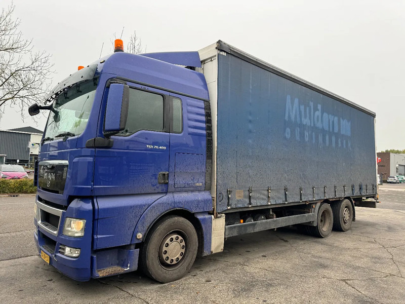 MAN TGX 26.400 6X2 - EURO 4 + LIFT + STEERING AXLE - Curtain side truck: picture 1 MAN TGX 26.400 6X2 - EURO 4 + LIFT + STEERING AXLE - Curtain side truck: picture 1